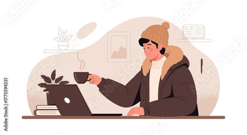 Cozy Winter Day: Person Working Indoors with a Coffee Cup and Laptop