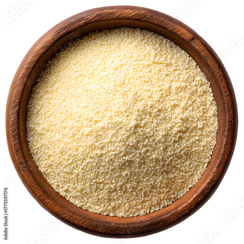 Wooden bowl filled with uncooked couscous grains on a dark view on transparent background