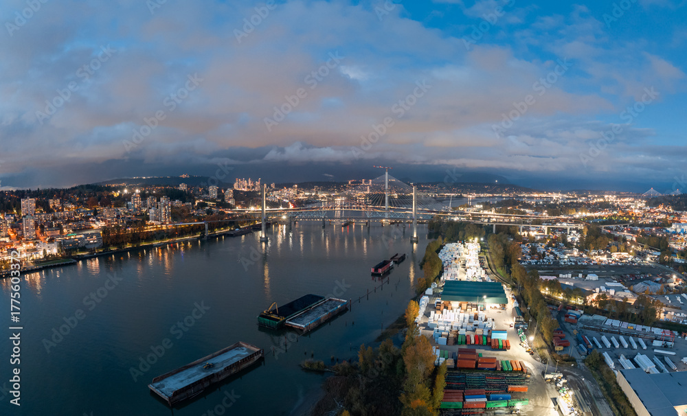 Obraz premium Evening Cityscape Over New Westminster: River, Bridge, And Industrial Waterfront In BC