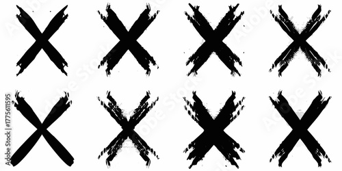 Collection of eight black brush stroke x marks isolated on white background grunge texture