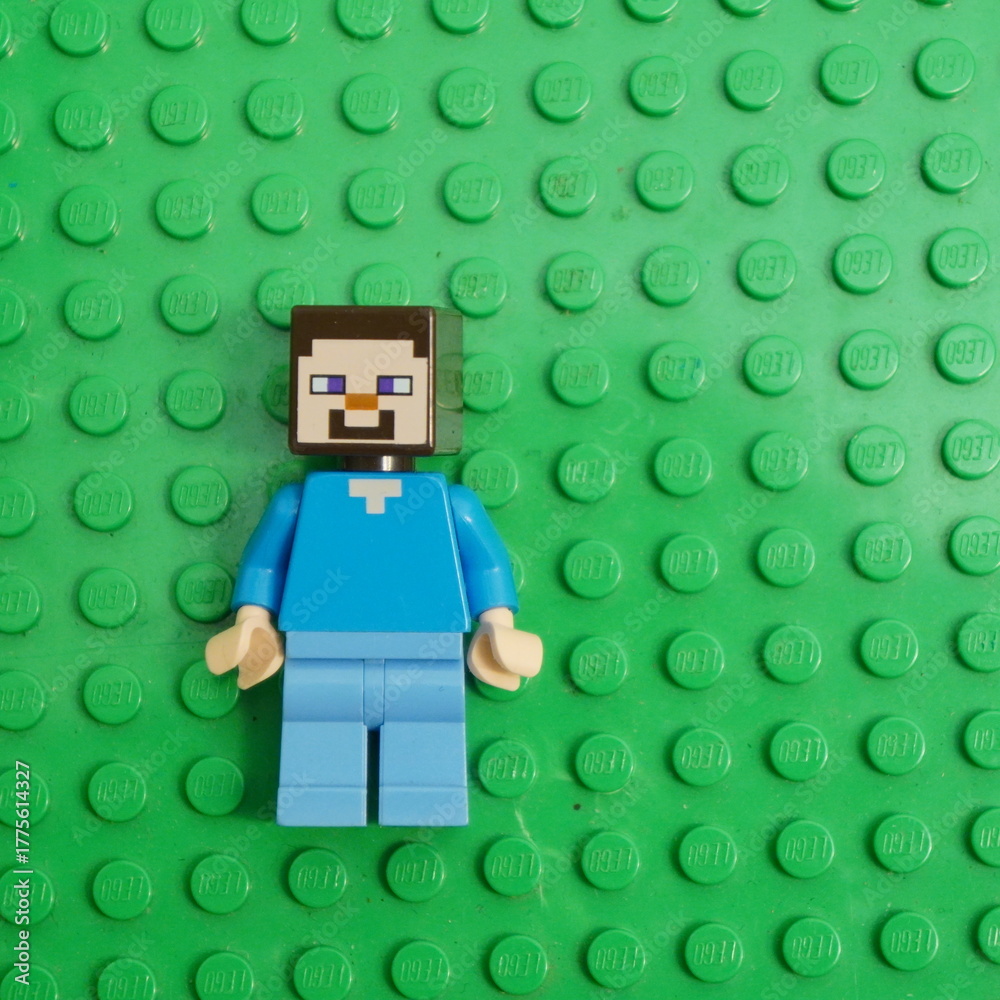 Naklejka premium Steve minifigure from Minecraft, a popular sandbox video game, depicted on a green LEGO baseplate