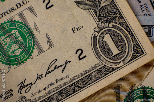 Slika na platnu Close-up view of United States one dollar bill alongside other currency, highlighting intricate design and historical details in Washington D