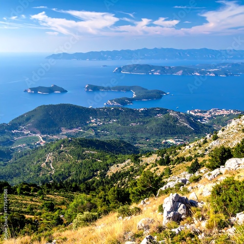 Wallpaper Mural Scenic panorama Lush hills, islands dotting the blue sea under bright sky Torontodigital.ca