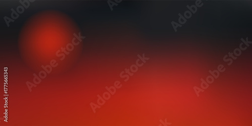 Out of focus sun setting over the ocean glowing orange with dark blue background