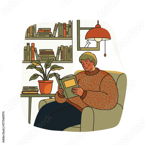 A person relaxing in an armchair reading a book near bookshelves