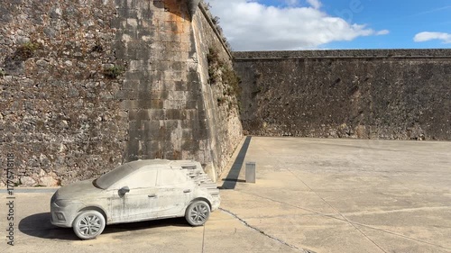 Cascais, Portugal, Largo de Camões area with stone sculpture of a car near the waterfront, public art and urban architecture in the historic coastal city