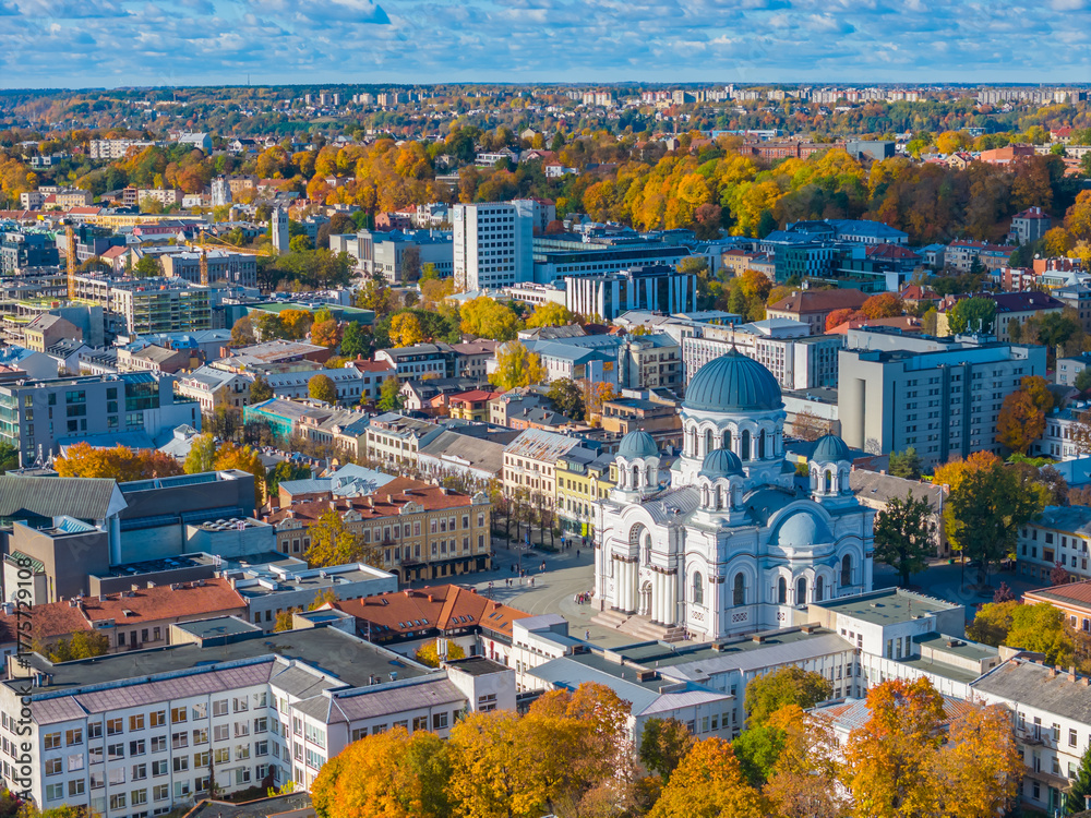 Naklejka premium Soboras - St. Michael the Archangel Church Sobor. Aerial drone view photo of Kaunas city center and Laisves aleja, Liberty avenue in Kaunas. Autumn
