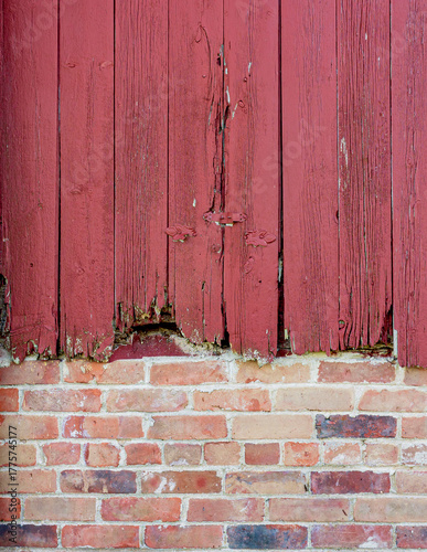 red brick wall with wooden barn slats