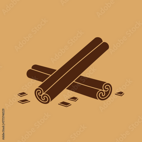 Two cinnamon sticks lie crossed with small pieces of cinnamon bark.