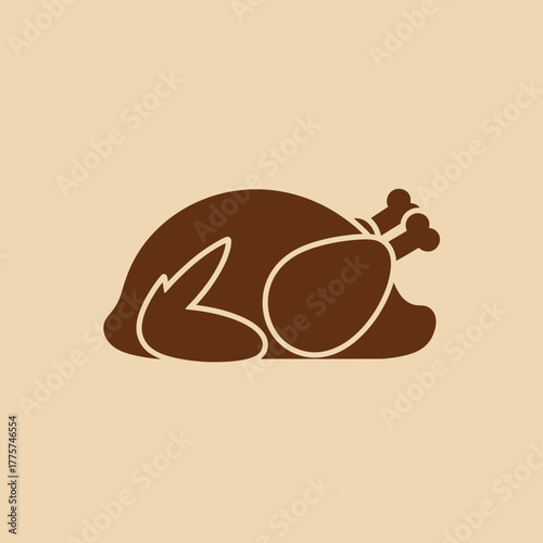 A brown roasted bird with drumsticks is lying down.