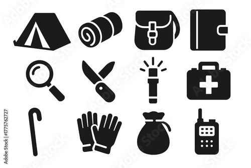 Explorer Gear Icons. Solid style icons of explorer gear: tent, bedroll, satchel, journal, magnifying glass, pocket knife, flare,
