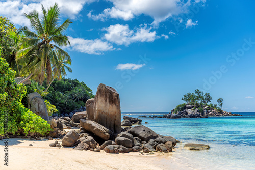 Beautiful cliffs and palm trees on a tropical island, Seychelles.