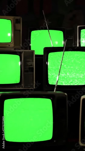 Wallpaper Mural Green Screen multiple vintage televisions on black background repeating pattern of many retro tvs with chroma key and noise interference 80s old bad signal reception scene 3 distortion, overlay Torontodigital.ca