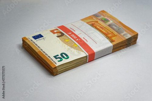 Stack of fifty euro banknotes totaling five thousand euros symbol of wealth and finance