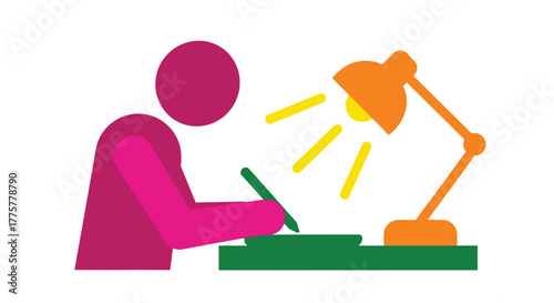 A person studies or works diligently at a desk with a lamp