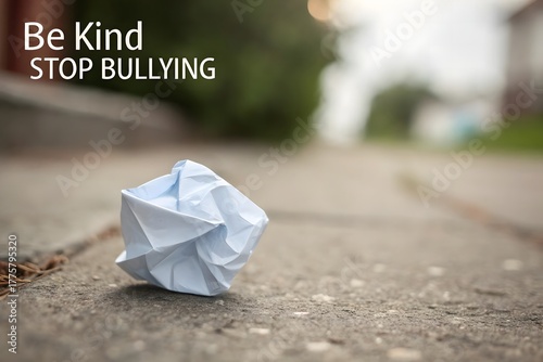 Crumpled Paper Symbolizing Ending Bullying on the Pavement