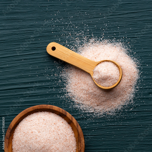 Himalayan pink fine salt - Salt in pure crystals in the bowl and spoon.