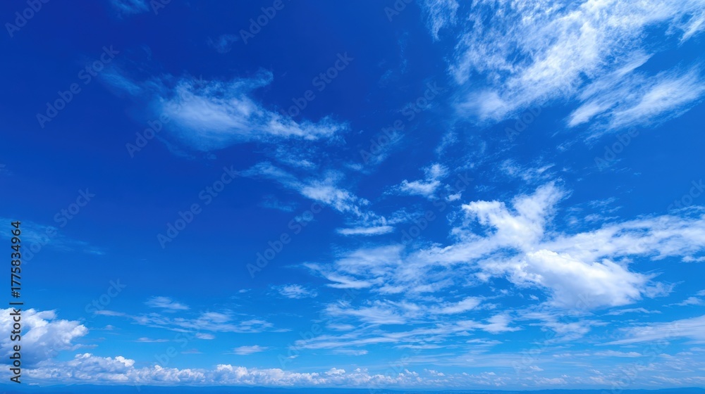 Fototapeta premium Vibrant Blue Sky Panorama with Wispy White Clouds - Nature, Weather, and Atmospheric Beauty
