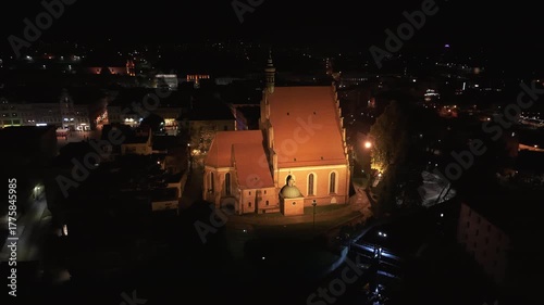 Aerial St Nicholas Cathedral Bydgoszcz Poland night 2 4K . Annual Christmas market and celebration. Historic population center northern Poland. River Brda. Modern and old architecture.