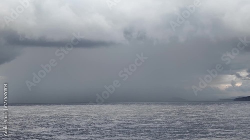 Heavy rain falls on a region in the Aegean Sea before a storm	
