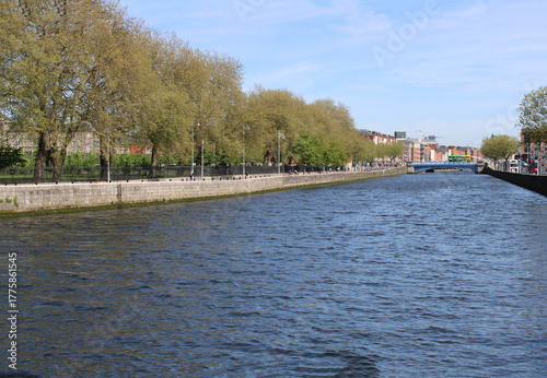 Photography River Liffey with trees on a sunny spring day in Dublin, Ireland