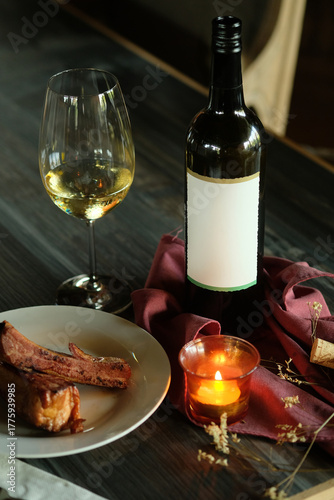 A romantic dinner setup with a bottle of wine, a glass, food, and candlelight. The scene conveys a sense of warmth, elegance, and intimacy. 