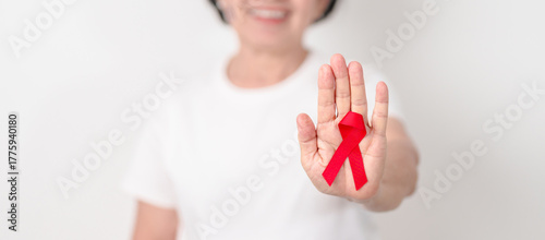 Elderly with Red Ribbon for December World Aids Day, MADD, October Red ribbon week, February Heart month, Marfan Syndrome, May Stroke awareness, March world TB Tuberculosis day and April Dare day