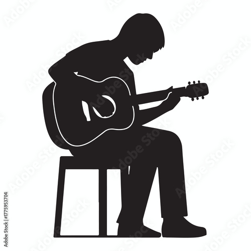 Silhouette of a person sitting on a stool playing an acoustic guitar