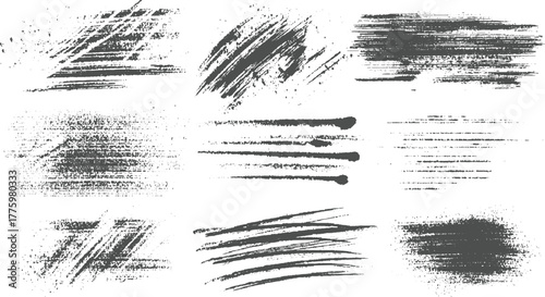 Collection of nine dark grey textured brush stroke and splatter graphic elements on white background