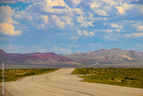 Cloud banks above the mountains along a desolate highway in rural Eastern Wyoming
