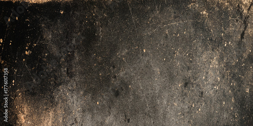 Textured black grunge wall design with cracked distressed surface old industrial tone abstract rough background.