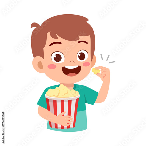 Happy Caucasian Boy Eating Popcorn Holding a Bucket of Popcorn and Looking Cheerful