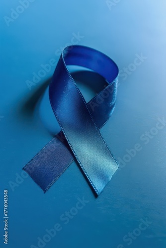 Blue ribbon symbol for world diabetes day awareness and support. Vertical banner. Copy space. Healthcare and medical concept. Parkinson's disease, Men's health awareness