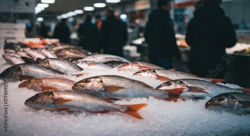 Fresh fish display on ice at a market, with blurred shoppers in background
