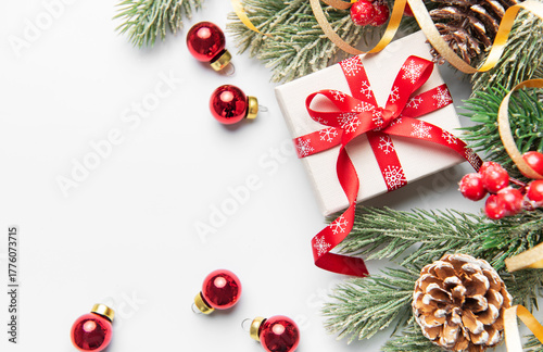 Christmas giftbox with pine branches and ornaments