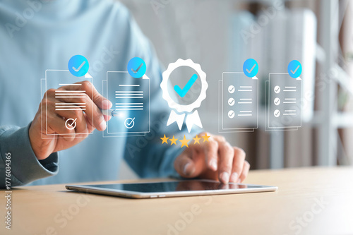 Checklist Businessman marks Document on digital checklist, representing quality assurance and document control process. ISO certified business, compliance with international standards .