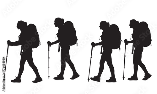 Four backpackers trekking together silhouette