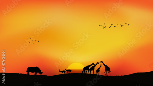 African sunset silhouette with wildlife. Rhinoceros, giraffes, and antelopes stand on the horizon against a vibrant orange and yellow sky with flying birds