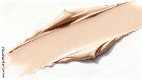 Luxurious creamy cosmetic texture applied on a white background