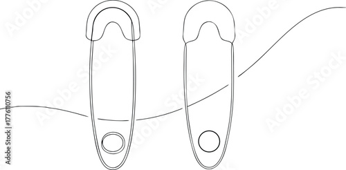Two safety pins with wavy lines in black and white