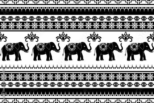 A black and white elephant pattern inspired by traditional Thai fabric motifs. This seamless design features decorative elephants with geometric tribal borders, perfect for textile design, wallpaper.