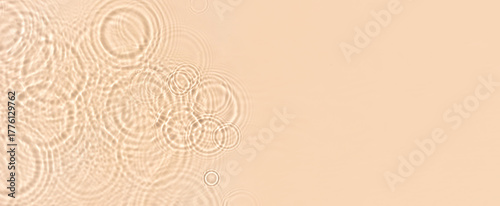 water texture ripples wave clean transparent water abstract background in beige color