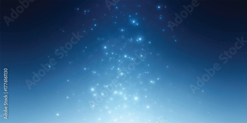 Sparkling light particles on a blue gradient background creating a magical and ethereal atmosphere perfect for adding a touch of wonder to designs