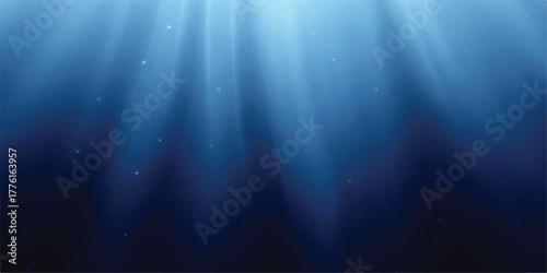 Underwater light rays shining down deep blue sea background perfect for marine life or ocean exploration concepts