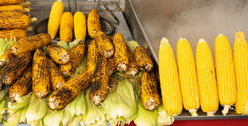 Photography Boiled and grilled corn cobs on street food cart display in Istanbul Turkey