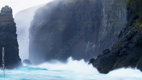 Misty cliffs meet crashing waves