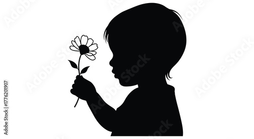 Silhouette of a young child holding a delicate flower against a bright white background