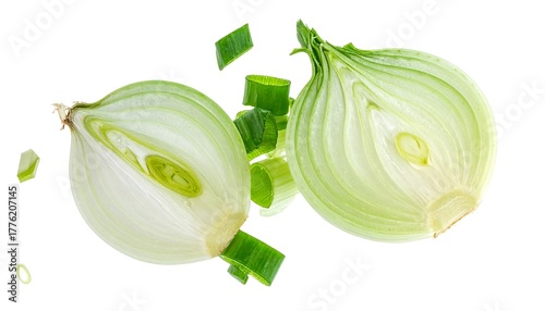 A perfectly-lit still life of a sliced onion half, accompanied by chopped green pieces