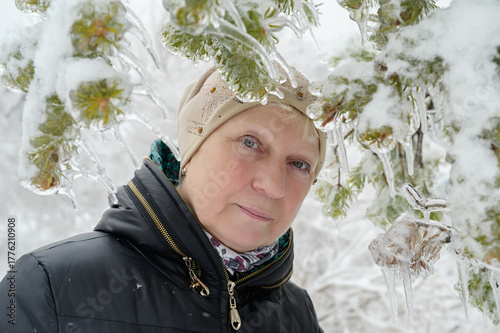 Winter portrait of a woman surrounded by ice and snow.