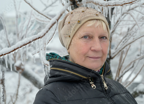 Winter portrait of a woman surrounded by ice and snow.